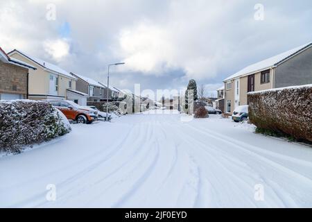 A road into a housing estate covered in snow, Fife, Scotland Stock Photo