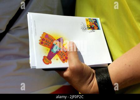 Kiev, Ukraine - June 28, 2022 - A person holds the Ukrainian Dream envelopes, Kyiv, capital of Ukraine. Sofiia Kravchuk, 11, from Liuboml, Volyn Region, depicted the Antonov An-225 Mriya aircraft in a drawing submitted to the What Does Ukraine Mean to Me? contest held in 2021, the year marking 30 years of Ukraine's independence. The An-225 Mriya ( (a 'dream' in Ukrainian) was destroyed in the Battle of Antonov Airport during the 2022 Russian invasion of Ukraine. This photo cannot be distributed in the Russian Federation. Photo by Evgen Kotenko/Ukrinform/ABACAPRESS.COM Stock Photo