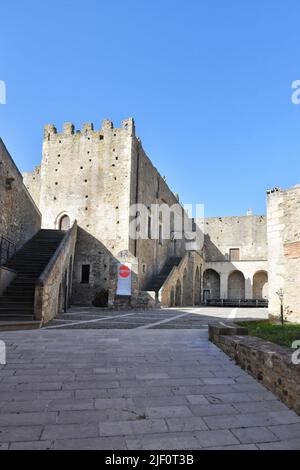 View of the inner courtyard of a medieval castle in Miglionico, a historic town in the province of Matera in Italy. Stock Photo
