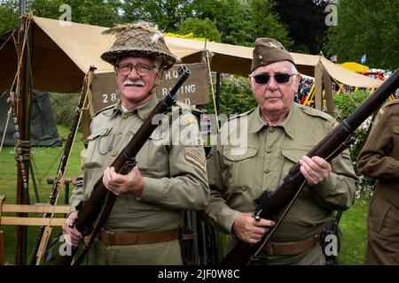 Haworth 1940's living history event (2 men on guard duty, dressed in khaki WW2 Dad's Army costume, encampment & HQ tent) - West Yorkshire, England UK. Stock Photo