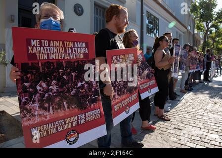 Athens, Greece. 28th June, 2022. Protesters hold banners and placards and shout slogans against EU's border policies. Following the recent Melilla massacre, members of PAME, the trade union affiliated to the greek communist party staged a demonstration outside the embassy of Spain. (Credit Image: © Nikolas Georgiou/ZUMA Press Wire) Stock Photo