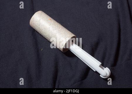 Lint remover on jumper Stock Photo