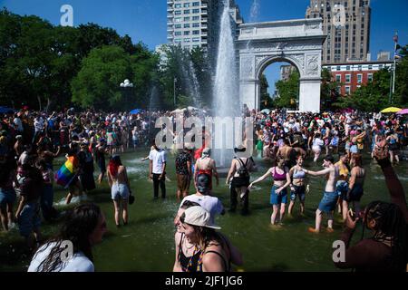 New York City, USA. 26th June, 2022. Demonstrators celebrate during the Pride rally at Washington Square Park fountain. Thousands of demonstrators marched from Foley Square to Washington Square Park, New York City in the Queer Liberation March for Pride. (Credit Image: © Karla Cot/SOPA Images via ZUMA Press Wire) Stock Photo