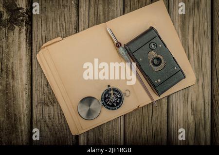 Traveler's accessories and costume on wooden background with copy space , travel concept. Stock Photo