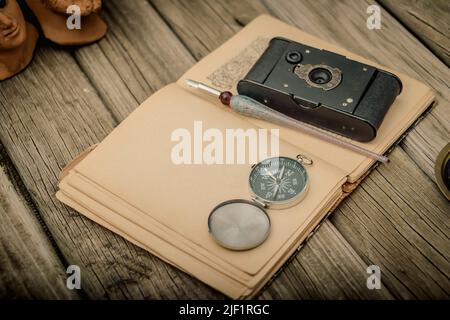 Traveler's accessories and costume on wooden background with copy space , travel concept. Stock Photo