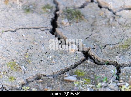 Large cracks form in arid ground amid drought Stock Photo