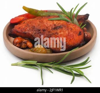 Fried chicken with rosemary over white background Stock Photo