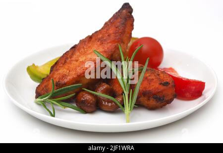 Fried chicken with rosemary over white background Stock Photo