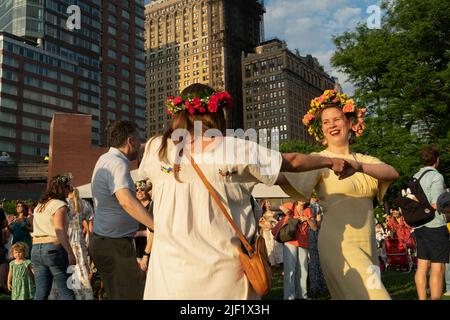 Since 1996, thousands of people have come to Battery Park City's Wagner Park for the Swedish Midsummer Festival. Stock Photo