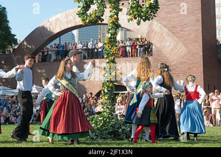 Since 1996, thousands of people have come to Battery Park City's Wagner Park for the Swedish Midsummer Festival. Stock Photo