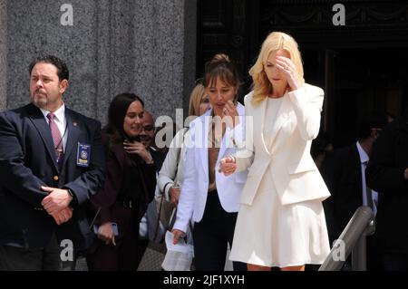 Annie Farmer and Sigrid McCawley exit the courthouse after the