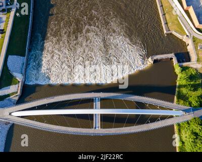 Aerial photograph of the Iowa Women of Achievement Bridge, a pedestrian bridge that spans the Des Moines River. Des Moines, Iowa, USA. Stock Photo