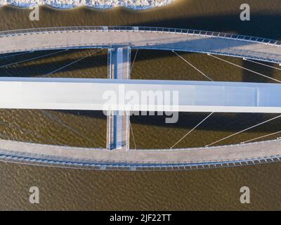 Aerial photograph of the Iowa Women of Achievement Bridge, a pedestrian bridge that spans the Des Moines River. Des Moines, Iowa, USA. Stock Photo