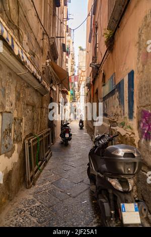 An intricate maze of narrow streets and alleys, they are the heart of Naples. Here in particular a glimpse Stock Photo