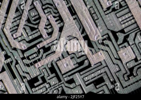 Differential interference contrast (DIC) Microchip surface. Differential interference contrast (DIC) light micrograph of the surface of a silicon wafer etched with integrated circuits. Magnification: x286 when printed 10 centimetres wide. Stock Photo