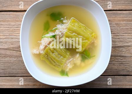 Stuffed bitter gourd with seasoned minced pork soup , Menu healthy food clear soup bowl with bitter gourd or bitter melon soup Stock Photo