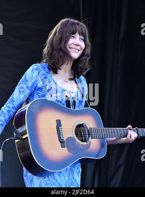 Singer, songwriter and guitarist Molly Tuttle is shown performing on stage during a “live” concert appearance with Molly Tuttle and Golden Highway at the Green River Festival. Stock Photo