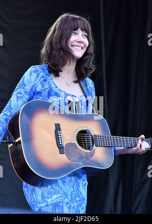 Singer, songwriter and guitarist Molly Tuttle is shown performing on stage during a “live” concert appearance with Molly Tuttle and Golden Highway at the Green River Festival. Stock Photo