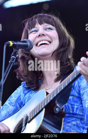 Singer, songwriter and guitarist Molly Tuttle is shown performing on stage during a “live” concert appearance with Molly Tuttle and Golden Highway at the Green River Festival. Stock Photo