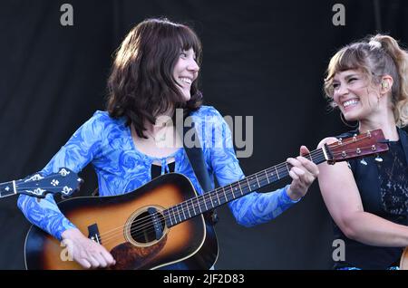 Singer, songwriter and guitarist Molly Tuttle is shown performing on stage during a “live” concert appearance with Molly Tuttle and Golden Highway at the Green River Festival. Stock Photo