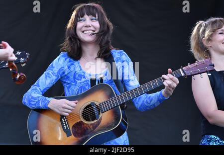 Singer, songwriter and guitarist Molly Tuttle is shown performing on stage during a “live” concert appearance with Molly Tuttle and Golden Highway at the Green River Festival. Stock Photo