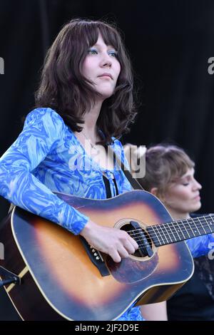 Singer, songwriter and guitarist Molly Tuttle is shown performing on stage during a “live” concert appearance with Molly Tuttle and Golden Highway at the Green River Festival. Stock Photo