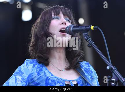 Singer, songwriter and guitarist Molly Tuttle is shown performing on stage during a “live” concert appearance with Molly Tuttle and Golden Highway at the Green River Festival. Stock Photo