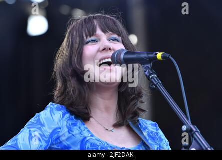 Singer, songwriter and guitarist Molly Tuttle is shown performing on stage during a “live” concert appearance with Molly Tuttle and Golden Highway at the Green River Festival. Stock Photo