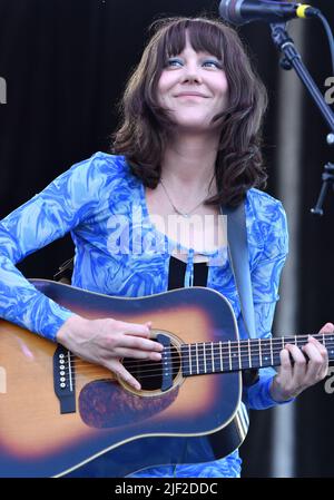 Singer, songwriter and guitarist Molly Tuttle is shown performing on stage during a “live” concert appearance with Molly Tuttle and Golden Highway at the Green River Festival. Stock Photo