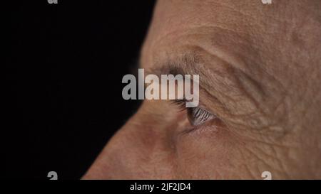 Close-up of the focused eyes of a businessman wearing computer . Stock Photo