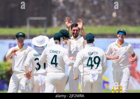 Galle, Sri Lanka. 29th June 2022. Australia's Mitchell Starc (C) celebrates with teammates after taking the wicket of Sri Lanka's Kusal Mendis during the 1st day of the 1st test cricket match between Sri Lanka vs Australia at the Galle International Cricket Stadium in Galle on 29th June, 2022. Viraj Kothalwala/Alamy Live News Stock Photo