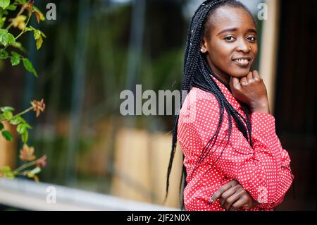 Pretty braids business african american lady bright bossy person friendly wear office red shirt. Stock Photo