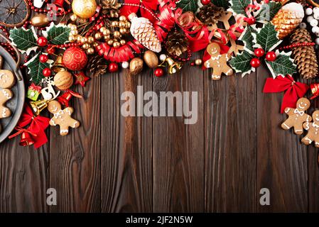 Christmas background of tray with gingerbread cookie men on wooden table Stock Photo