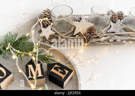 Sweet home. White Christmas decor on vintage natural wooden background. Stock Photo