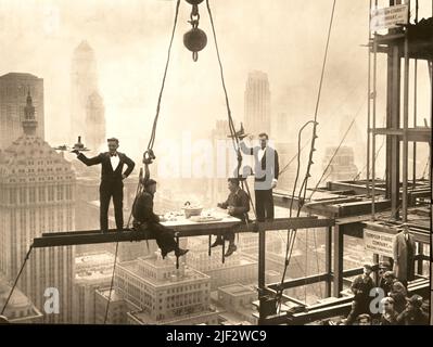 Two Waiters Serve Two Steel Workers on Steel Girders on the Waldorf Astoria Hotel Construction - Quirky Iconic Photography, New York City, USA - 1930 Stock Photo