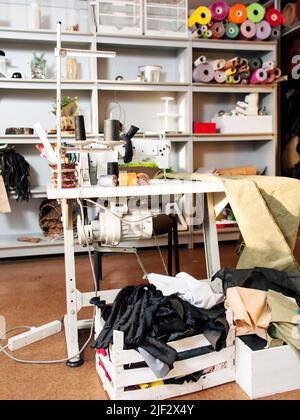 Mess in sewing workshop. Stock Photo
