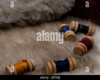 sewing set with wool coils on a fur coat Stock Photo