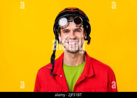 Portrait of attractive cheerful funny guy wearing vintage helm specs isolated over bright yellow color background Stock Photo