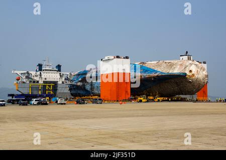 March 31, 2017-Mokpo, South Korea-The Sewol ferry, lifted from where it sank some three years ago in the country's southwestern waters, is brought to a port in Mokpo, some 100 kilometers away, on March 31, 2017. The doomed ship will be put on dry dock, and a search will begin to find the remains of nine people still missing from the sinking on April 16, 2014, who are among the 304 killed in the tragedy. Stock Photo