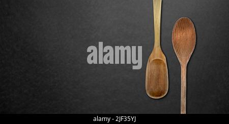 Topview of Cooking Wooden Spoons on Dark Background Stock Photo