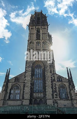 Tower of the St. Salvator Church Duisburg, the Gothic basilica is today a Protestant city church, blue sky with white clouds, NRW, Germany, Europe Stock Photo