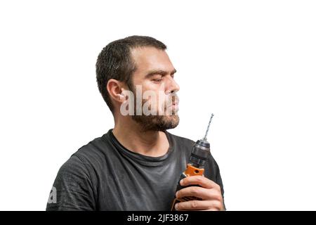 Selective focus shot of man posing with drill. Stock Photo