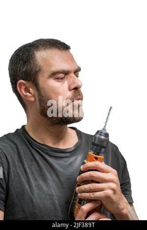 Selective focus shot of man posing with drill. Stock Photo