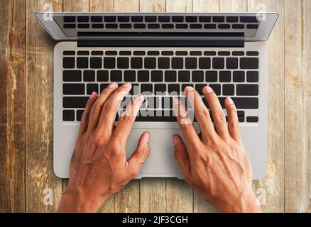 Close up hands typing on a keyboard. Top view. Business concept Stock Photo
