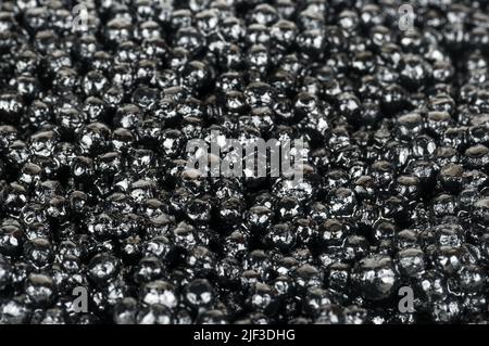 Background of fresh black caviar close up Stock Photo