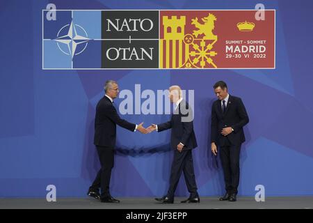 Madrid, Spain. 29th June, 2022. NATO Secretary General Jens Stoltenberg (L) greets President Joe Biden as Spain's Prime Minister Pedro Sanchez looks on during a NATO summit in Madrid, Spain, Wednesday, June 29, 2022. Photo by Paul Hanna/UPI Credit: UPI/Alamy Live News Stock Photo