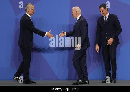 Madrid, Spain. 29th June, 2022. NATO Secretary General Jens Stoltenberg (L) greets President Joe Biden as Spain's Prime Minister Pedro Sanchez looks on during a NATO summit in Madrid, Spain, Wednesday, June 29, 2022. Photo by Paul Hanna/UPI Credit: UPI/Alamy Live News Stock Photo