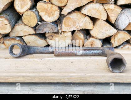 Antique wrenches on a wooden background, rusty tools, metal waste, scrap metal, wrench collection Stock Photo