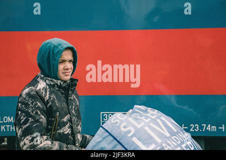 March 9, 2022, ZÂ·hony, Szabolcs-SzatmÃr-Bereg, Hungary: Ukrainian boy walks around the station with his belongings. The train station in ZÃhony is the main access point of Hungary for thousands of refugees fleeing the Russian invasion. (Credit Image: © Lara Hauser/SOPA Images via ZUMA Press Wire) Stock Photo