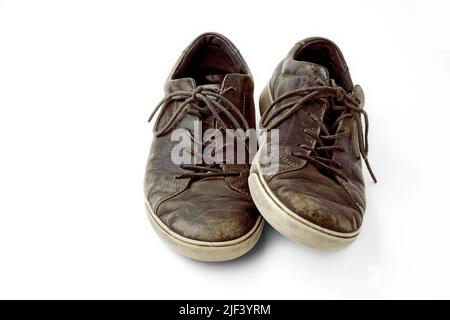 Beautifully aged vintage brown leather boots isolated on white background Stock Photo